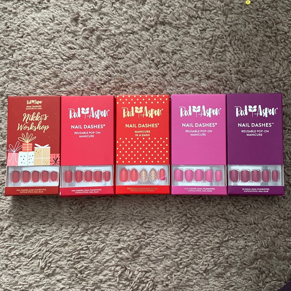 New and unopened bundle of 5 red and purple Red Aspen Nail Dashes